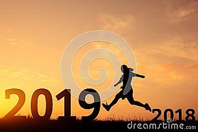 Happy new year jumping from 2018 to 2019. Stock Photo