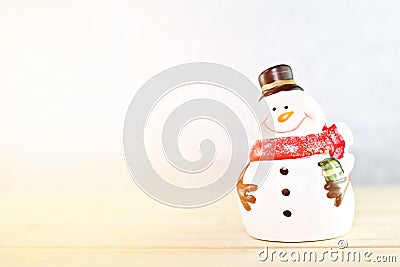 Santa Claus doll on wooden table and bright abstract background Stock Photo