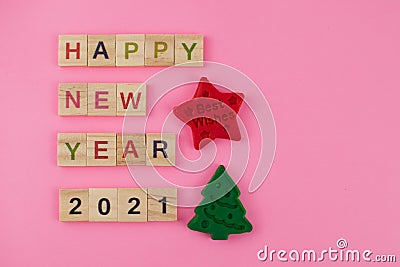 Happy New Year and Merry Christmas. Scrabble letters, playdough and plasticine. Letter tiles spelling celebration holiday Stock Photo