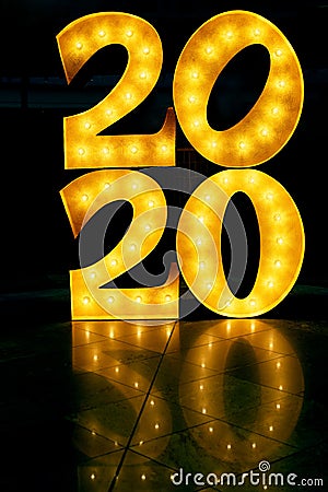 Happy New Year 2020. Number 2020 lights on the floor. Beautiful overlay template for New Year greeting card. Stock Photo