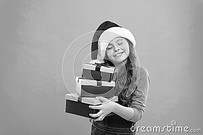 Happy new year. Packaging for gifts. Lot presents. Christmas celebrated throughout globe. Small girl hold pile gift Stock Photo