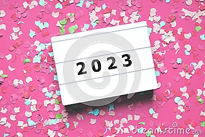 happy new year 2023 party celebration flat lay with confetti in pink Stock Photo