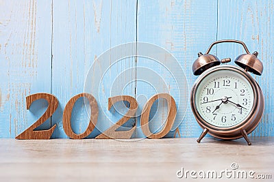 2020 Happy New Year with retro alarm clock and wooden number. New Start, Resolution, Goals, Plan, Action and Mission Concept Stock Photo