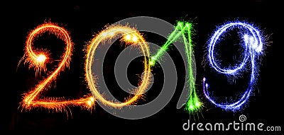 2019 with sparklers on black background Stock Photo
