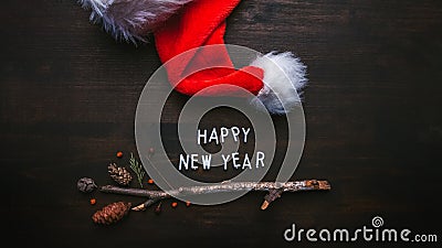 Happy New Year text with Santa Claus hat Stock Photo