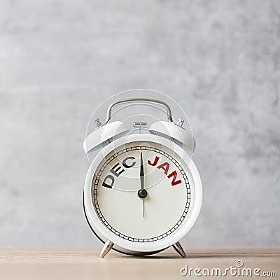 Happy New Year with vintage alarm clock and December change to January month. Merry Christmas, New Start, Resolution, countdown, Stock Photo