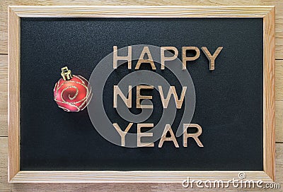 Happy New Year with wooden letters on a wooden background Stock Photo