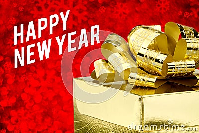 Happy new year word with Golden gift box with ribbon and colorful confetti at blur red snowflake boekh light background,Winter ho Stock Photo