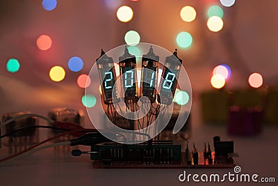 Happy new year is written with a lamp light. Radio electronic lamps. 2018. Original designed congratulation with a Stock Photo