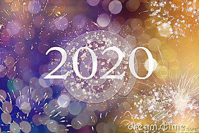 Happy new year 2020 written with Sparkle fireworks and bokeh Stock Photo