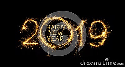 Happy New Year 2019 written sparklers on black background Stock Photo