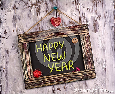 Happy new year written on Vintage sign board Stock Photo