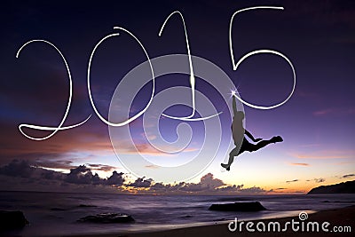 Happy new year 2015.young man jumping and drawing 2015 Stock Photo