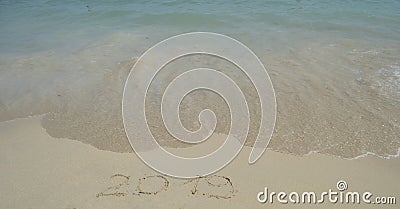 2019 handwritten on sand at the beach Stock Photo