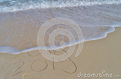 Happy New Years 2018 and 2019 handwritten on sand Stock Photo