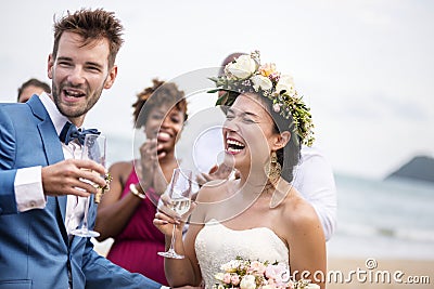 Happy newlyweds at beach wedding Stock Photo