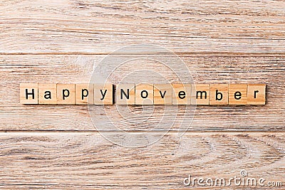 Happy november word written on wood block. Happy november text on table, concept Stock Photo