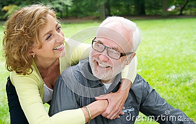 Happy older couple laughing outdoors Stock Photo