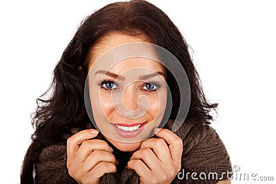 Happy older woman holding collar of sweater Stock Photo