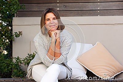 Happy older woman relaxing outside Stock Photo