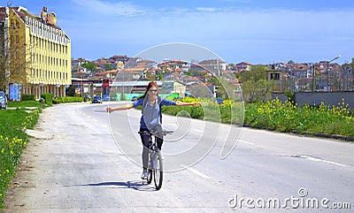 Smiling outstretched arms biker woman Stock Photo