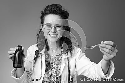 Happy paediatrician woman with childrens suspension on Stock Photo