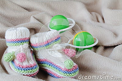 Happy parenting concept. Bewborn shoes on soft background Stock Photo