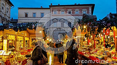 Happy people making shopping at the famous christmas market of Montepulciano in Tuscany Editorial Stock Photo