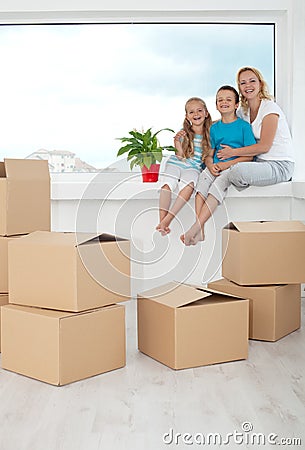 Happy people with a potted plant in their new home Stock Photo