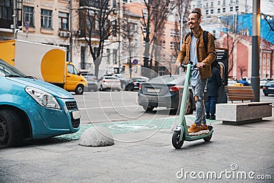 Happy person enjoying using ecofriendly personal vehicle in the city Stock Photo