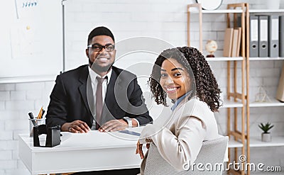 Happy personnel manager and African American vacancy candidate on job interview in office Stock Photo
