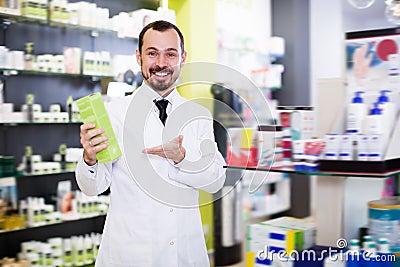Happy pharmacist suggesting useful drug Stock Photo