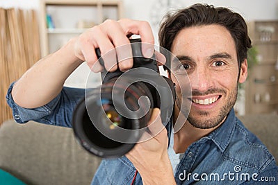 Happy photographer working in studio Stock Photo