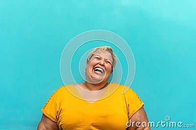 Happy plus size woman portrait - Curvy overweight model having fun smiling at camera Stock Photo