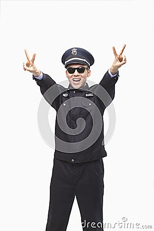 Happy Police Officer Giving Peace Sign and Wearing Sunglasses, Studio Shot Stock Photo