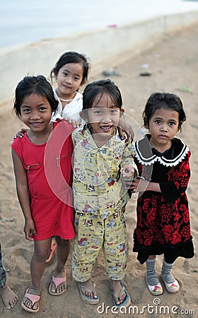 Happy poor girl in tropical asia village Editorial Stock Photo