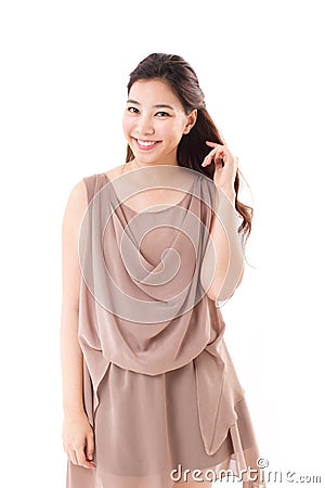 Happy, positive asian woman in brown dress Stock Photo