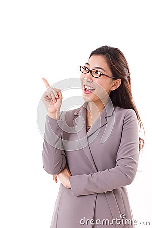 Happy, positive female business executive, business woman pointing up Stock Photo