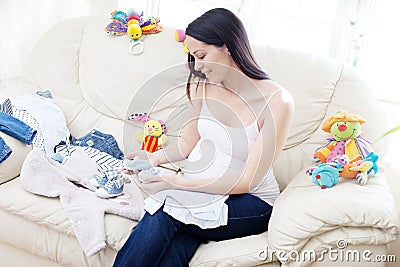 Happy pregnant caucasian brunette woman Stock Photo