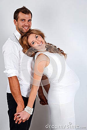 Happy Pregnant Couple on white background Stock Photo