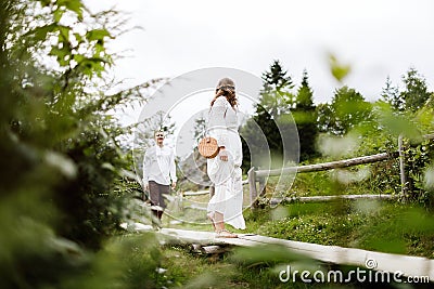 Happy pregnant family having fun time in summer nature. Stock Photo
