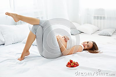 Happy Pregnant Woman Feels Healthy and Gets Some Fun. Healthy Fo Stock Photo