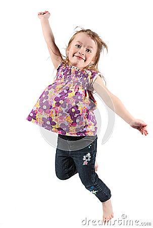 Happy preschool girl jumping Stock Photo