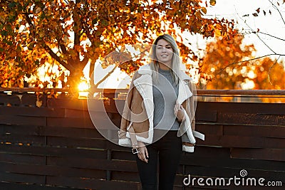 Happy pretty joyful young woman in a stylish gray sweater Stock Photo