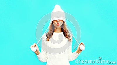 Happy pretty woman blowing red lips sends an air kiss Stock Photo