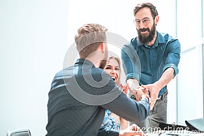 Happy project Manager shaking hands with employee. Stock Photo