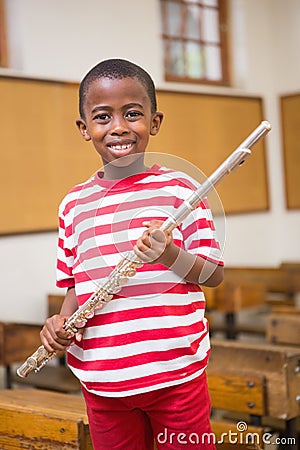 Happy pupil holding flute Stock Photo