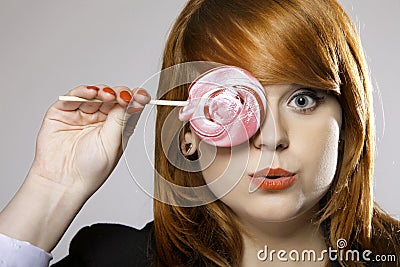 Happy redhair woman with lollipop candy Stock Photo