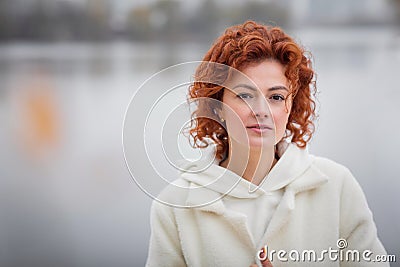 Happy redhair woman in white clothes Stock Photo