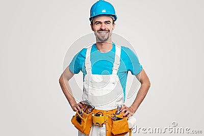 Positive professional builder with manual tools Stock Photo